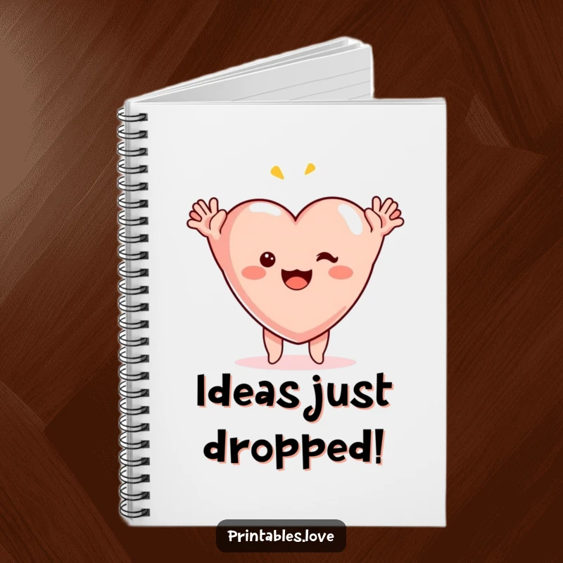 Funny surprise heart notebook, a cute heart illustration with arms thrown up, signifying a moment of bright, comic inspiration.